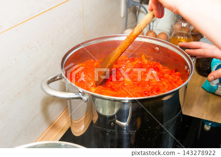 Cooking tomato sauce in big cooking pot Cooking tomato sauce in big cooking pot 143278922