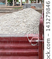 Crushed stone and gravel loaded in a construction dump truck bed 143279846
