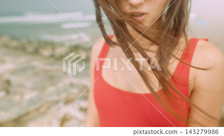 Woman in swimsuit. Intimate portrait of woman in red swimwear Woman in swimsuit. Intimate portrait of woman in red swimwear 143279986