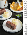 Delicious glazed curd snacks with fresh blueberries and mint on light grey table, closeup 143280080