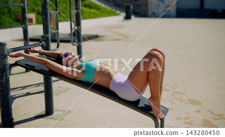 Deep stretching workout on beach with focus and mindfulness 143280450