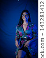 Smiling woman in floral blazer wearing glasses 143281412