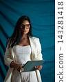 Businesswoman holding digital tablet with stylus and case 143281418