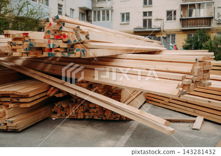 Stacked timber and roofing materials at construction site for roof renovation Stacked timber and roofing materials at construction site for roof renovation 143281432