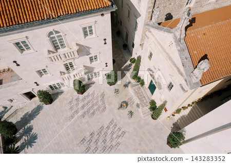 Aerial view of wedding ceremony setup at St. Mark's Church Perast Aerial view of wedding ceremony setup at St. Mark's Church Perast 143283352