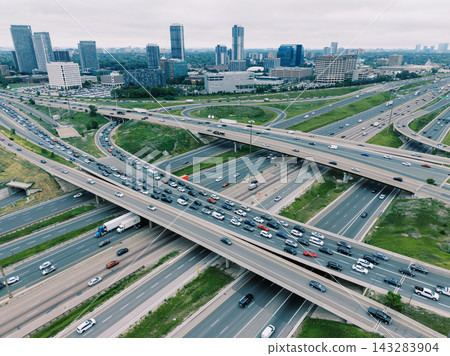 Busy highway interchange with city skyline in North York Ontario Busy highway interchange with city skyline in North York Ontario 143283904