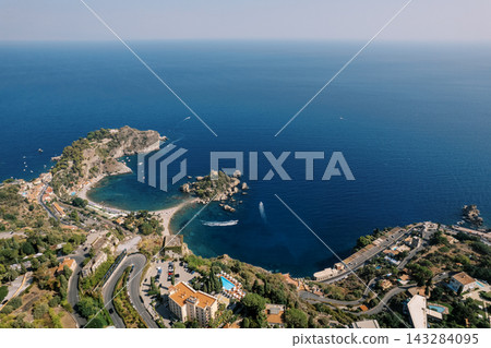 Aerial view of Isola Bella and coastline in Taormina Sicily Aerial view of Isola Bella and coastline in Taormina Sicily 143284095