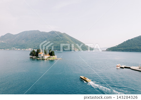 Island monastery and boats in Bay of Kotor Montenegro 143284326