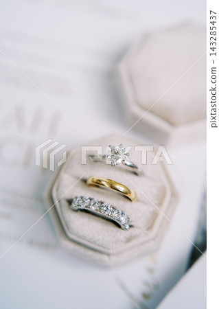 Minimalist visual presentation highlighting elaborate wedding jewelry craftsmanship Minimalist visual presentation highlighting elaborate wedding jewelry craftsmanship 143285437