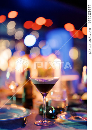 Opulent pub environment showcasing reflective martinis within fashionable surroundings Opulent pub environment showcasing reflective martinis within fashionable surroundings 143285475