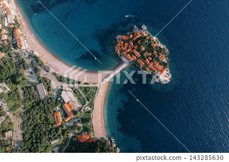 Vivid aerial view of coast. Captivating aerial footage showcasing beaches and harbor scenes Vivid aerial view of coast. Captivating aerial footage showcasing beaches and harbor scenes 143285630