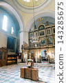 Orthodox Church With Radiant Decor. Sacred Space Illuminated By Warm Sunlight And Icons 143285675