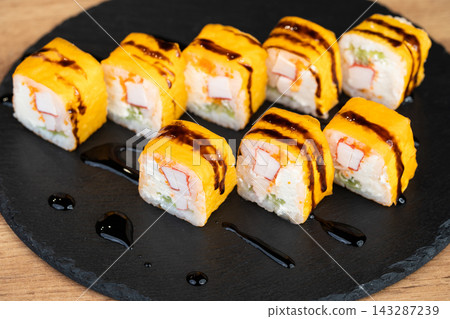 delicious traditional Japanese sushi and rolls on a plate delicious traditional Japanese sushi and rolls on a plate 143287239