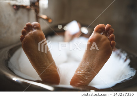 funny close up photo of feet in bubble bath funny close up photo of feet in bubble bath 143287330