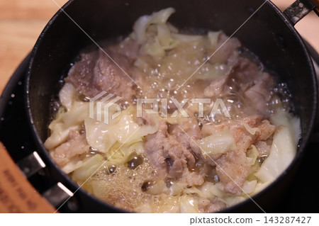 Sizzling Meat and Cabbage in Cooking Pan Sizzling Meat and Cabbage in Cooking Pan 143287427