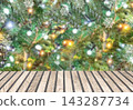 Christmas tree lights and snowflakes above a wooden table with copy space for holiday product display. Winter background, Christmas decor, New Year celebration, seasonal greeting, festive display art. 143287734