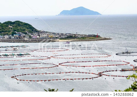 Fishing village scenery and marine aquaculture pens in Kashiwajima, Otsuki Town, Kochi Prefecture. Fishing village scenery and marine aquaculture pens in Kashiwajima, Otsuki Town, Kochi Prefecture. 143288862