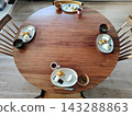 A Japanese-style breakfast prepared for the family on a round table. 143288863