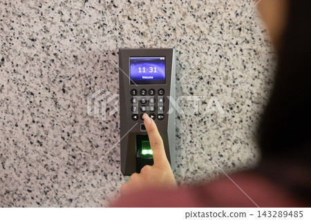 Woman entering office room using keyless access system Woman entering office room using keyless access system 143289485