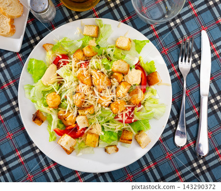Caesar salad with tomatoes served in diner Caesar salad with tomatoes served in diner 143290372