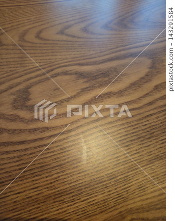 It is a close-up of a wooden table. It is a close-up of a wooden table. 143291584