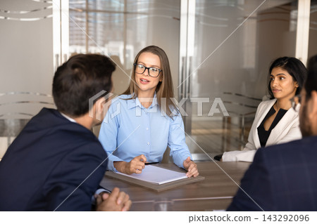 Team leader conducting formal conversation at business meeting in office Team leader conducting formal conversation at business meeting in office 143292096