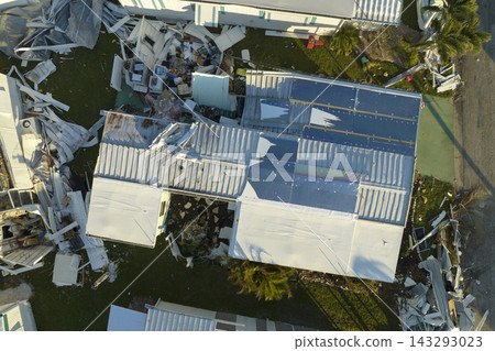 Aerial view of natural disaster consequences in Florida Southwest region. Severely damaged by hurricane Ian mobile homes in residential area Aerial view of natural disaster consequences in Florida Southwest region. Severely damaged by hurricane Ian mobile homes in residential area 143293023