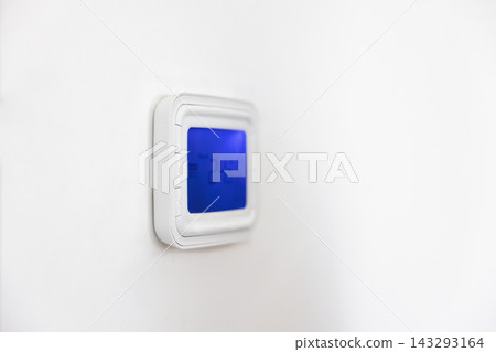 Wall mounted panel of digital thermostat with blue backlit screen Wall mounted panel of digital thermostat with blue backlit screen 143293164