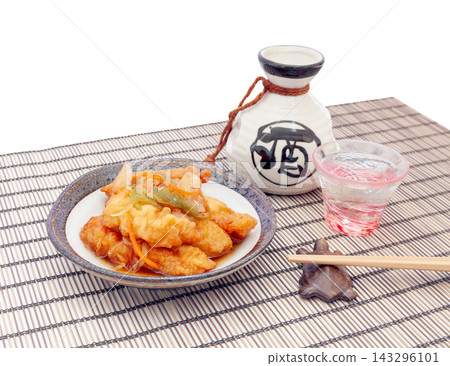 Chicken tempura marinated in sweet and sour sauce and chilled sake [white background] 143296101