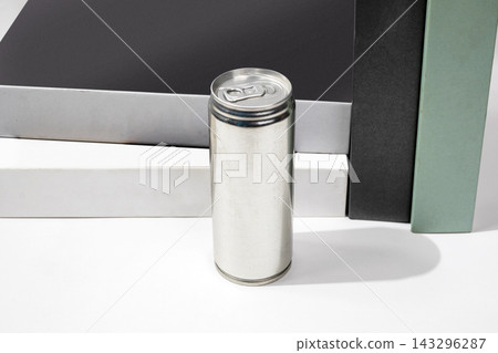 A blank silver aluminum beverage can standing vertically against a minimalist background of geometric shapes in black, white, and mint green. A blank silver aluminum beverage can standing vertically against a minimalist background of geometric shapes in black, white, and mint green. 143296287