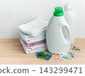 Laundry supplies and folded towels for household chores 143299471