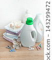 Laundry products with clean towels and orchids on wood 143299472