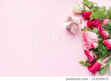 Rose bouquet and gift box on pink background Rose bouquet and gift box on pink background 143299478