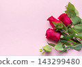 Red roses bouquet with eucalyptus on pink background 143299480