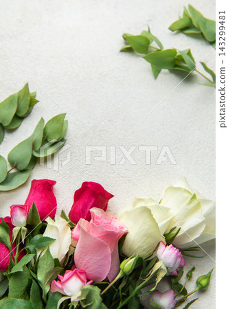 Roses and eucalyptus creating floral background with copy space Roses and eucalyptus creating floral background with copy space 143299481