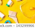 Painting tools on a yellow background 143299966