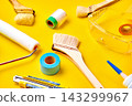 Painting tools on a yellow background 143299967