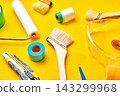 Painting tools on a yellow background 143299968