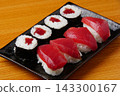 Tekkamaki (tuna roll) and tuna nigiri 143300167
