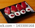 Tekkamaki (tuna roll) and tuna nigiri 143300168