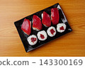 Tekkamaki (tuna roll) and tuna nigiri 143300169