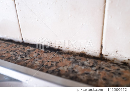 Black Mold on Silicone Sealant Between Tile and Countertop Black Mold on Silicone Sealant Between Tile and Countertop 143300652