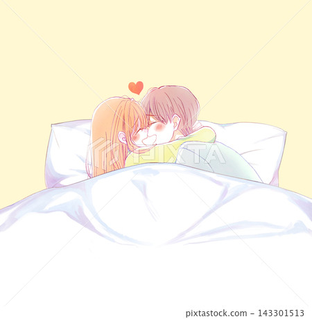 A man and a woman hugging and laughing, in their pajamas, under the covers. 143301513