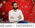 Smiling man with crossed arms on Christmas background 143304431