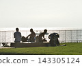 Silhouettes of people resting on the deck at Nishihama Beach 143305124