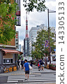 Tokyo Tower visible at the end of the sidewalk in Hamamatsucho 143305133