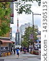Tokyo Tower visible at the end of the sidewalk in Hamamatsucho 143305135