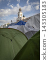 Temporary encampment in Puerta del Sol Madrid with tents tarps signs and temporary structures set up in the central square 143305183