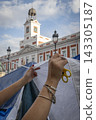 Temporary encampment in Puerta del Sol Madrid with tents tarps signs and temporary structures set up in the central square 143305187