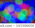 Abstract rainbow background with bokeh effect on a dark background. Christmas background with multicolored blurred lights. 143306656